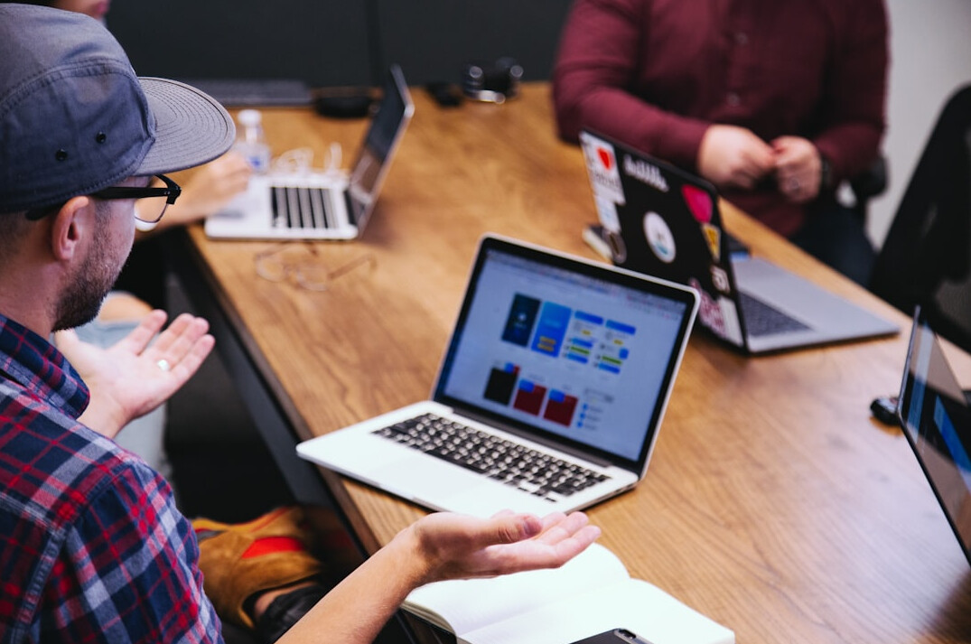 corporate team discussing software