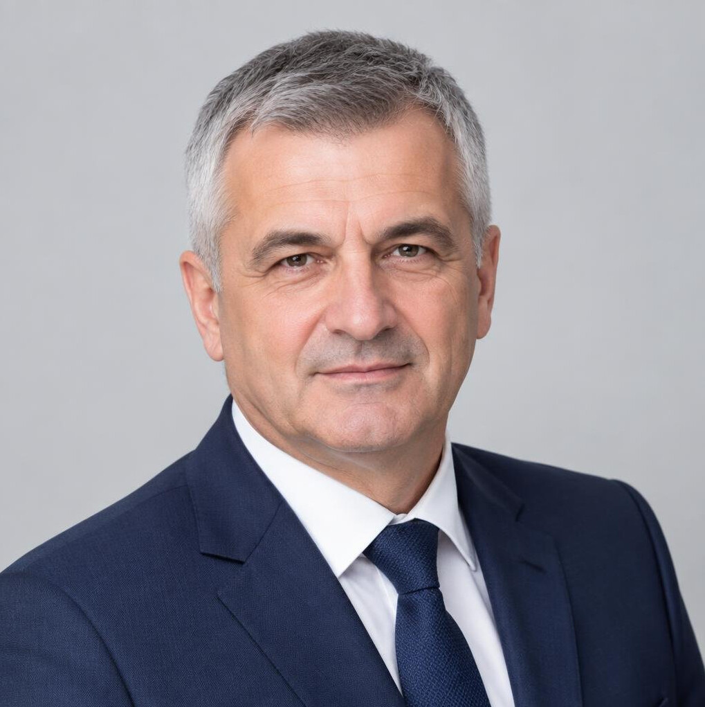 Studio portrait of a mature Croatian businessman with gray hair