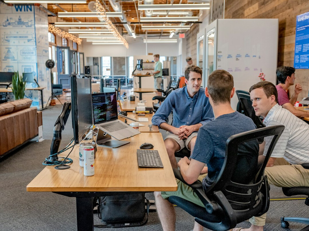 corporate team discussing software